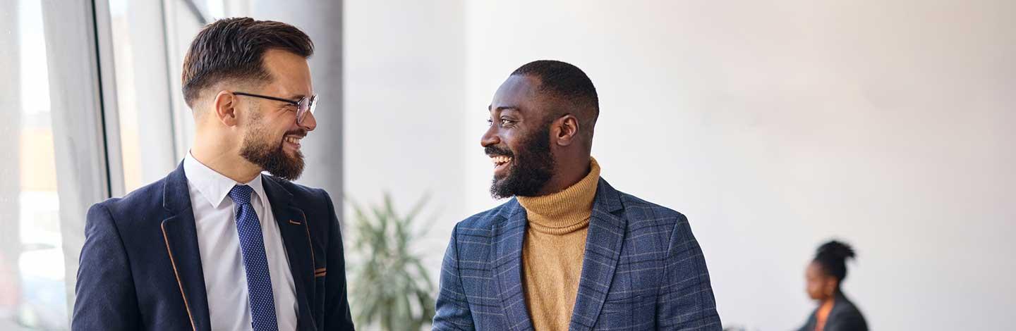 Active allies talking to one another at work