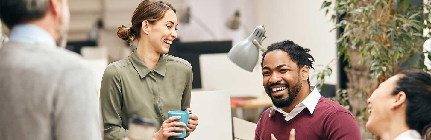 Four diverse colleagues discussing work