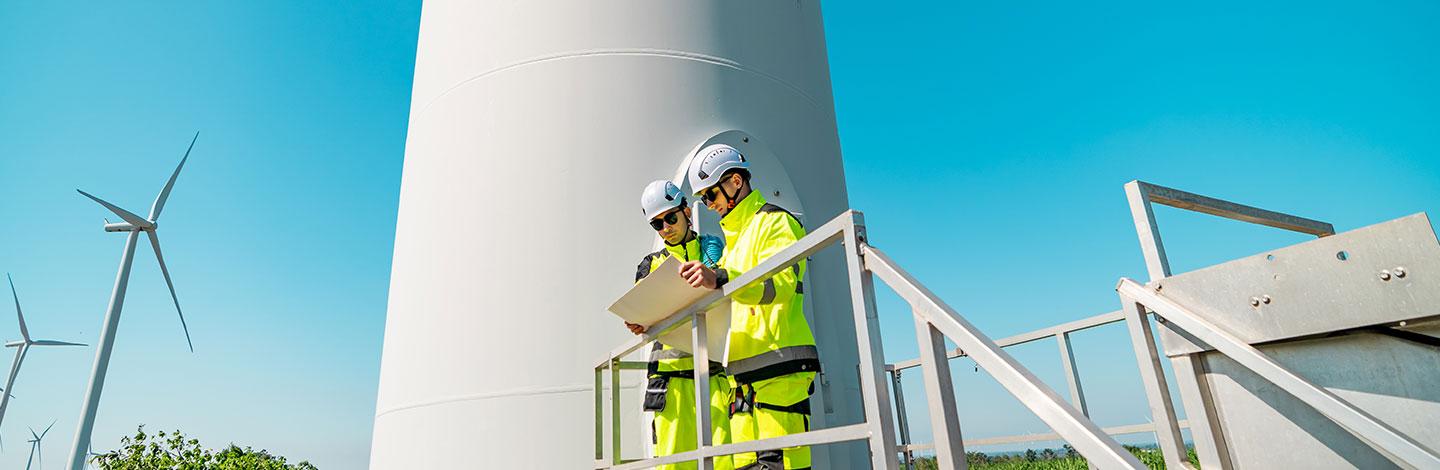 Engineers working in green energy on wind turbines