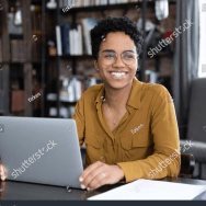 Women on laptop smiling 